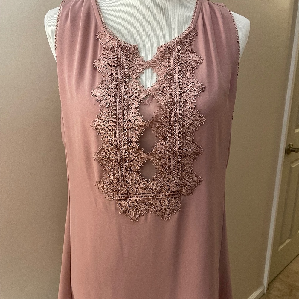 Sleeveless shell with embroidered neckline